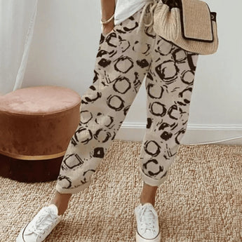 Lightweight relaxed fit lilac floral joggers for women in beige color, size 3XL, with a focus on the waist and thigh areas, suitable for active wear.