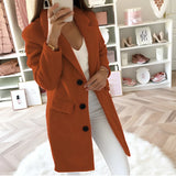
A women's tailored long black double-breasted blazer, featuring a notched collar and long sleeves, suitable for an office chic look. The blazer is displayed in a dark brown color in size 4XL.