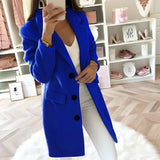 Women's long blue double-breasted blazer in a tailored office chic style, featuring structured shoulders, a defined waist, and long sleeves.
