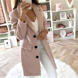 Long black double-breasted blazer for women with tailored fit, featuring a rose color accent, suitable for office wear.