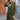 Women's long blue oversized zip-up hoodie in urban streetwear style, featuring long sleeves and worn with sunglasses for a fashionable look.