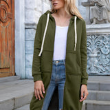Women's long blue oversized zip-up hoodie styled as urban streetwear, featuring a relaxed fit with full-length sleeves. A person wearing the hoodie is accessorized with black sunglasses, emphasizing a fashionable street style look.