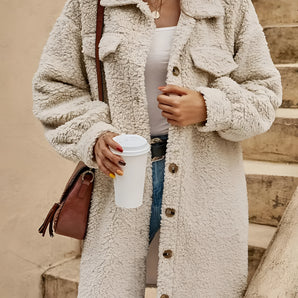 Beige women's long button-front teddy coat with a cozy fleece texture, featuring a collar, long sleeves, and a tailored waist design.