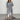 
A women's long flowy grey kimono cardigan in a size 5XL, featuring wide sleeves and a lightweight fabric suitable for versatile summer wear. The cardigan drapes elegantly, reaching knee-length, and is showcased against a simple white background.