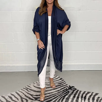 Women's long flowy grey kimono cardigan, shown in marine blue color, featuring wide sleeves and a loose, knee-length fit.