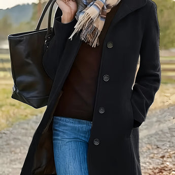 Women's long green tweed wool coat for fall fashion in a button-down style, featuring a trench coat design with a tartan pattern. The coat is displayed on a model wearing sunglasses, with visible neck and sleeve details.
