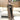 Women's long brown cardigan in 3XL size, featuring a cozy design ideal for spring fashion layering, shown draped on a white furniture background.