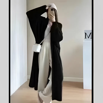 Women's long pink cardigan with full-length sleeves, designed for cozy spring fashion, displayed on a model wearing the Nero color option in size 3XL.