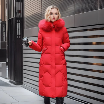 Women's long red winter coat with fur hood, insulated and quilted design, featuring long sleeves, suitable for cold weather.