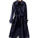 
A marine blue women's luxury trench coat in a XXXL size, featuring a double-breasted design with a structured collar, long sleeves, and a fitted waist for a formal and sophisticated look.