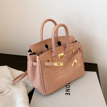 Luxury designer tote handbag crafted from white crocodile leather with a pink hue, featuring a rectangular shape, shoulder strap, and elegant fashion design, ideal for women.