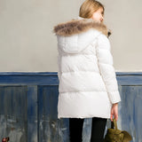 Women's luxury white puffer jacket with a fur hood, designed as a winter coat with a focus on fashion. The jacket features a long sleeve and waist-length cut, showcasing a blend of natural materials, and offers knee to thigh coverage, adding elegance and warmth for the colder seasons.