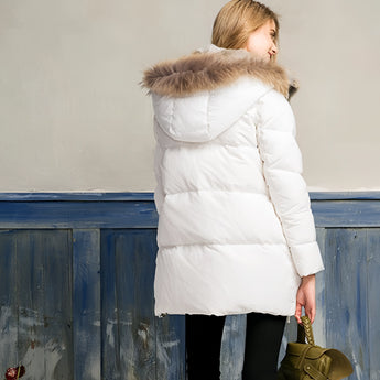Women's luxury white puffer jacket with a fur hood, designed as a winter coat with a focus on fashion. The jacket features a long sleeve and waist-length cut, showcasing a blend of natural materials, and offers knee to thigh coverage, adding elegance and warmth for the colder seasons.