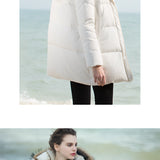 Women's luxury white puffer jacket with fur hood, featuring a stylish and warm design, perfect for winter. The coat showcases a sleek outerwear look, emphasizing the shoulders and arms, with a focus on the crisp white color and plush fur details.