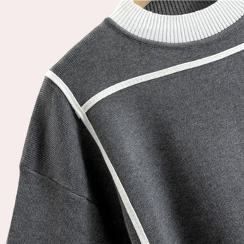 Women's monochrome athletic set featuring a black and white sweatshirt and joggers, showcasing a sportswear design with a structured collar and sleeves.