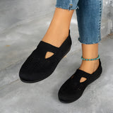 Women's black slip-on walking shoes with a breathable mesh upper, lightweight design, suitable for casual or sportswear.