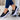 Women's navy blue buckle loafer sneakers with platform sole, featuring a stylish design and comfortable fit.