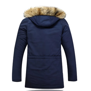 Women's navy blue faux fur hooded insulated water-resistant parka with a fitted waist, long sleeves, and a cozy faux fur-lined collar.