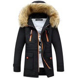 
A navy blue women's parka with a hood lined with faux fur, featuring insulated and water-resistant material. The coat has long sleeves and a high collar for added warmth, styled for fashion and practicality.