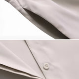Women's navy blue linen shirt and pants set, featuring a casual summer design with long sleeves and a collar.