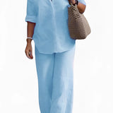 Women's light blue linen shirt and pants set with a collared dress shirt and long sleeves, designed for a casual summer look.