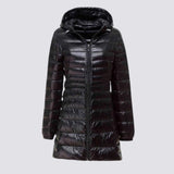 Women's navy long hooded puffer coat in size 5XL, featuring a sleek design with a water-resistant and insulated material, long sleeves, and a protective collar.