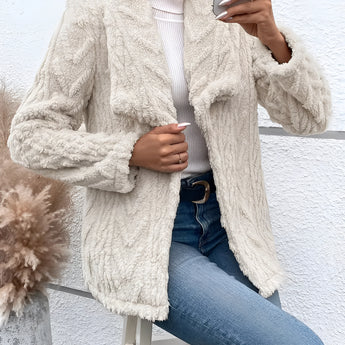 Women's off-white textured fleece jacket with faux fur collar, featuring long sleeves and a stylish design.