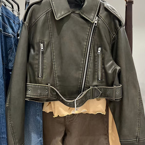 Women's olive green belted biker leather jacket with an asymmetric zipper, featuring long sleeves, a stylish collar, and a fashionable design.