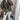 Women's olive green belted biker leather jacket with asymmetric zip, featuring long sleeves and a tailored fit, shown in a black color variant in XL size.