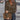 
Woman wearing a trendy olive green sweater with lace sleeves, showcasing a stylish knitwear design.