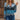 Women's ombre gradient knit sweater in multicolor earth tones, featuring a blue hue, size XL. The sweater has a fashionable design with long sleeves, a round neck, and a comfortable fit suitable for various casual occasions.