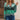 Women's multicolor earth tone ombre gradient knit sweater in size XL, featuring a mix of green shades. The sweater has long sleeves and a round neckline, crafted from a cozy textile with a stylish shoulder design.