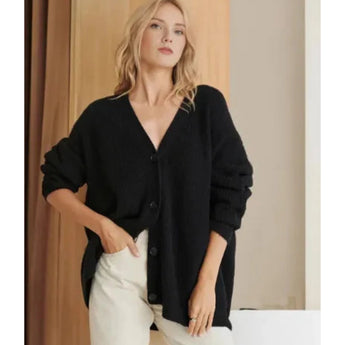 Oversized chunky knit wool cardigan in beige, designed for women, featuring long sleeves and a relaxed fit.