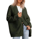 
A woman wearing an oversized chunky knit wool cardigan in beige, featuring long sleeves and a cozy collar, suitable for casual winter wear. The image highlights the shoulder and arm area, emphasizing the cardigan's comfortable fit.