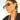 Woman wearing oversized black aviator sunglasses with gradient UV protection, covering her eyes and part of her forehead, nose, and eyebrows.