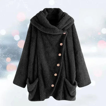Women's oversized black fleece coat in 5XL, featuring a plush teddy texture. The jacket includes spacious pockets, a classic collar, and long sleeves, designed for warmth and style.