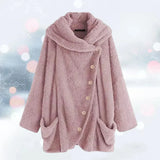 
A plush pink oversized fleece coat for women, designed in a teddy style with a collar and long sleeves. The jacket features pockets and showcases a comfortable and stylish outerwear fashion design.