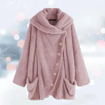 
A plush pink oversized fleece coat for women, designed in a teddy style with a collar and long sleeves. The jacket features pockets and showcases a comfortable and stylish outerwear fashion design.