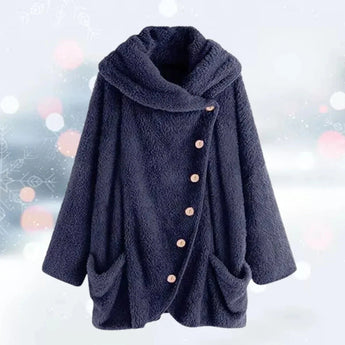 Women's oversized plush teddy jacket in a rich marine blue color, featuring a soft fleece texture and large pockets, styled with a collar and long sleeves.