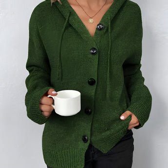 Women's oversized chunky knit cardigan in forest green, featuring a button-up design, with long sleeves and a cozy wool texture, suitable for a stylish and warm outerwear option.