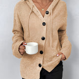 Women's oversized chunky knit cardigan in forest green, featuring a button-up front and wool material, shown in an XL size with a focus on the sleeves and collar.