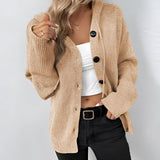 Women's oversized chunky knit cardigan in forest green, featuring a button-up front, long sleeves, and wool material.