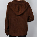 Women's oversized chunky knit cardigan in forest green, featuring a button-up design with long sleeves and a woolen texture.