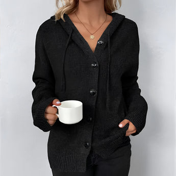 Women's oversized chunky knit cardigan in forest green, featuring a button-up design with long sleeves and a cozy wool texture, shown in an XL size.