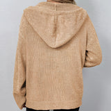 Oversized chunky knit cardigan for women in forest green with a button-up design, featuring long sleeves and a woolen texture.