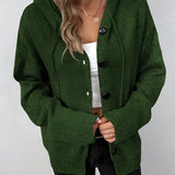 Women's forest green oversized chunky knit cardigan with button-up design, featuring long sleeves and a cozy wool texture.