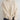 Women's oversized cream turtleneck chunky knit sweater in beige, featuring long sleeves, a thick woolen texture, and a high collar.