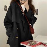 Women's oversized double-breasted blazer in black, featuring a chic fashion design with long sleeves and a classic collar, perfect for formal events or as stylish outerwear in an XL size.