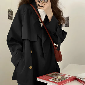 Women's oversized double-breasted blazer in black, featuring a chic fashion design with long sleeves and a classic collar, perfect for formal events or as stylish outerwear in an XL size.