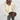 Women's oversized gray V-neck sweater featuring a relaxed fit, shown in a white color variant, size 2XL. The image highlights the sweater's knitted texture, long sleeves, and draped shoulder design, ideal for autumn wear.